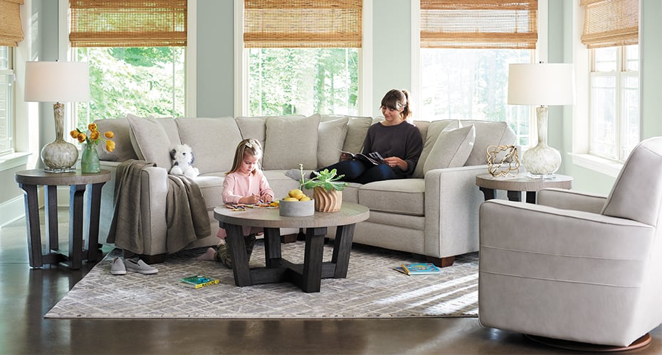 mom and daughter with beige meyer sectional